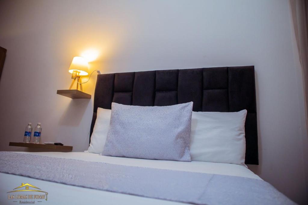 Ένα ή περισσότερα κρεβάτια σε δωμάτιο στο Las Lomas de Fonavi