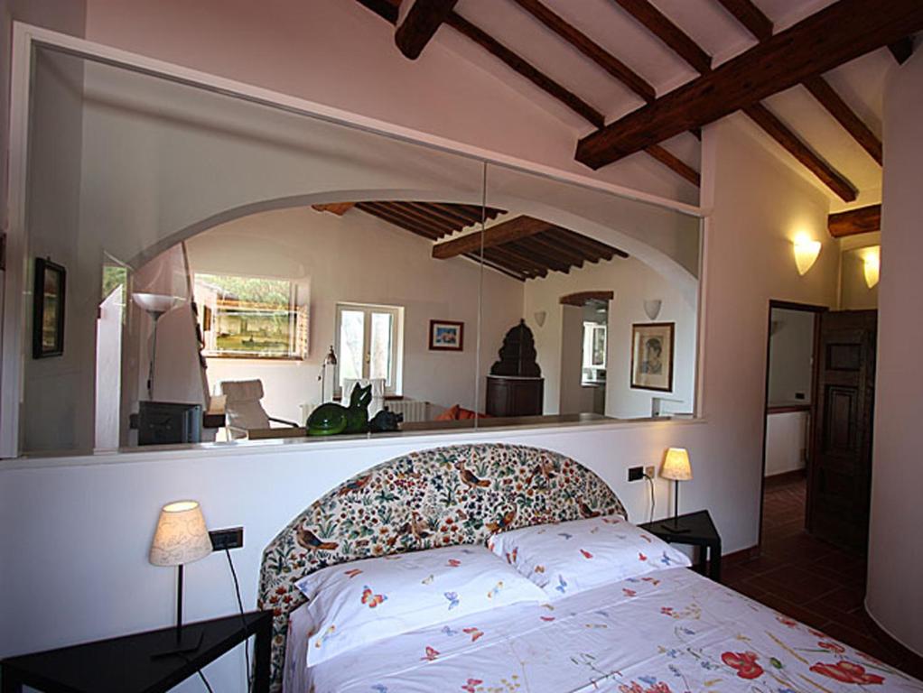 a bedroom with a large bed in a room at Villa San Giuseppe in Porto Azzurro