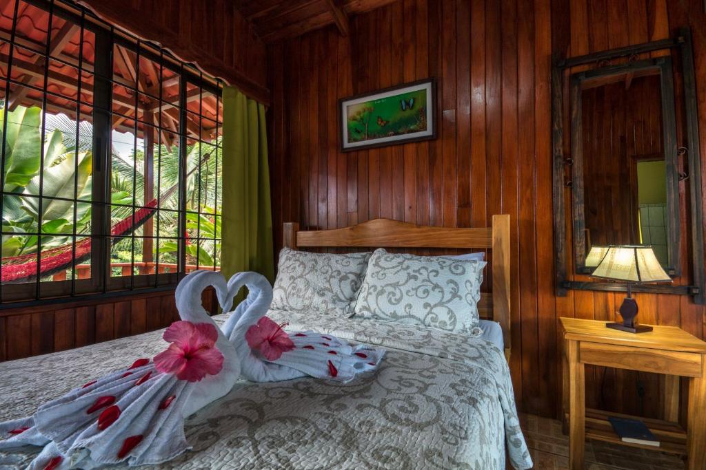 Postel nebo postele na pokoji v ubytování Hotel Rancho Cerro Azul