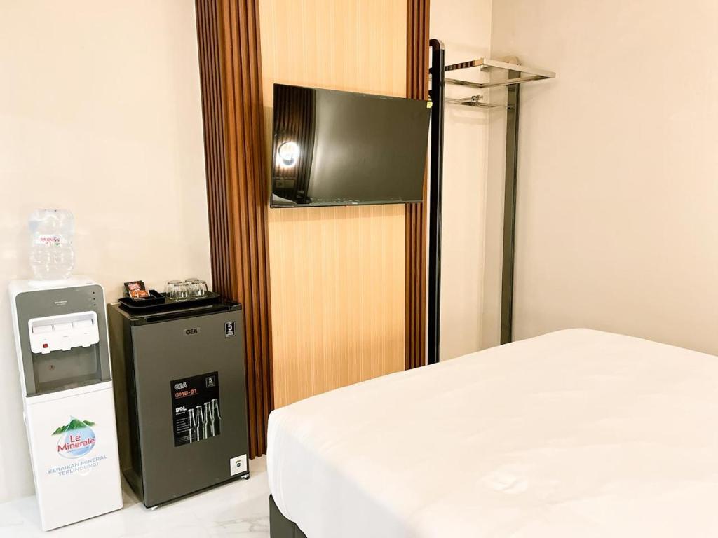 Postel nebo postele na pokoji v ubytování Verse Hotel Cirebon