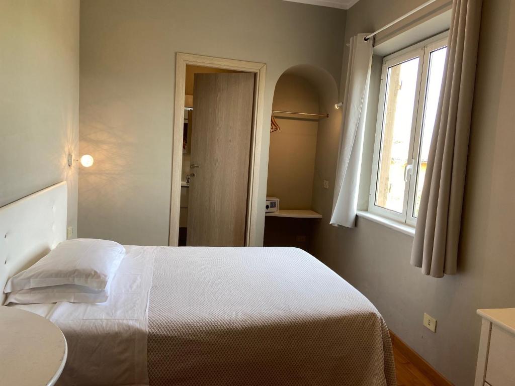 Postel nebo postele na pokoji v ubytování Antica Locanda Palmieri