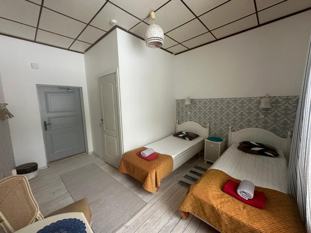 Voodi või voodid majutusasutuse Guesthouse Kadrina Mõis toas