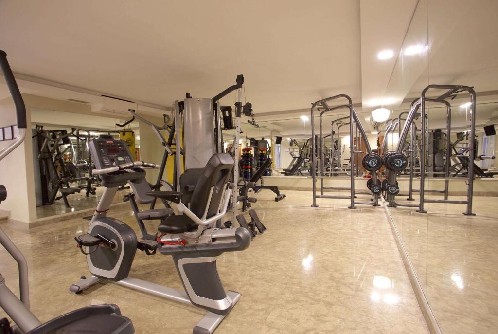 a gym with several exercise equipment in a room at Ramada By Wyndham İstanbul Taksim in Istanbul