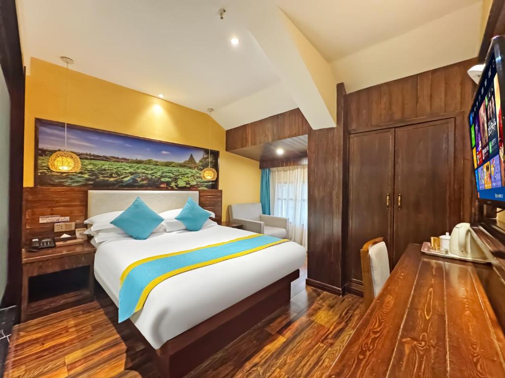 Postel nebo postele na pokoji v ubytování Yiwu Ruifeng Hotel