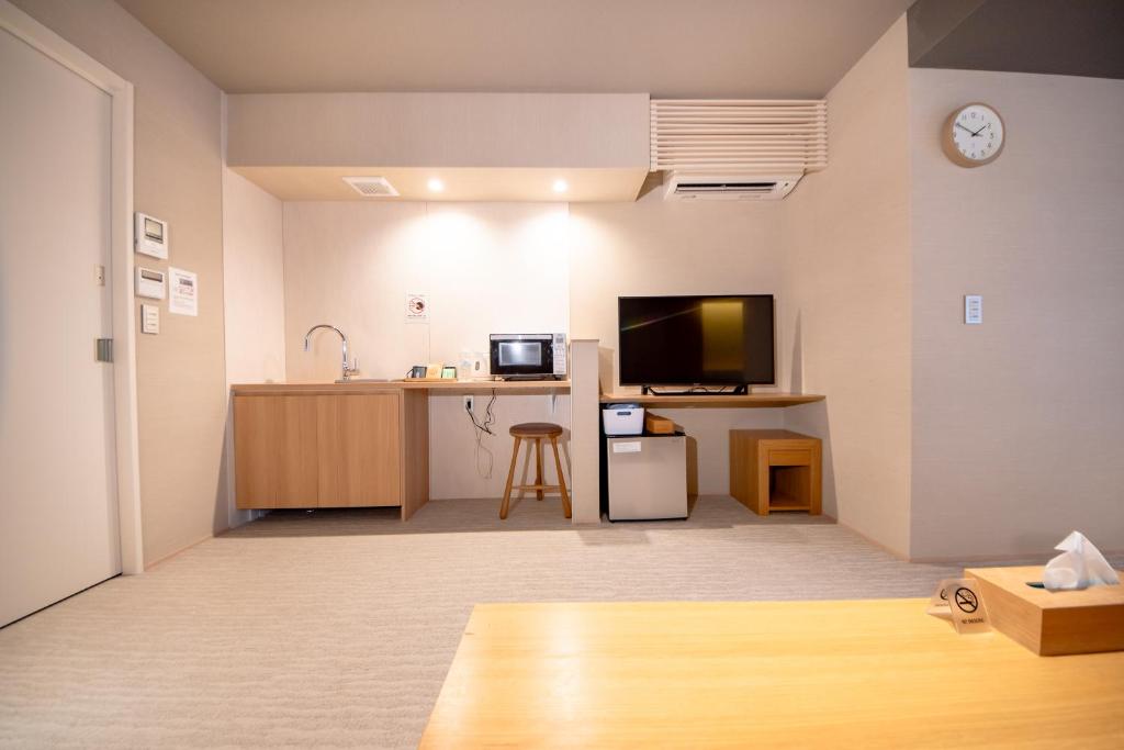 TV a/nebo společenská místnost v ubytování Hotel Rokune