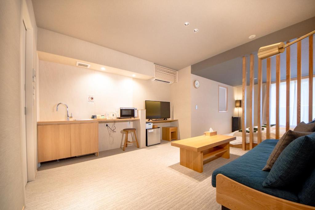 TV a/nebo společenská místnost v ubytování Hotel Rokune