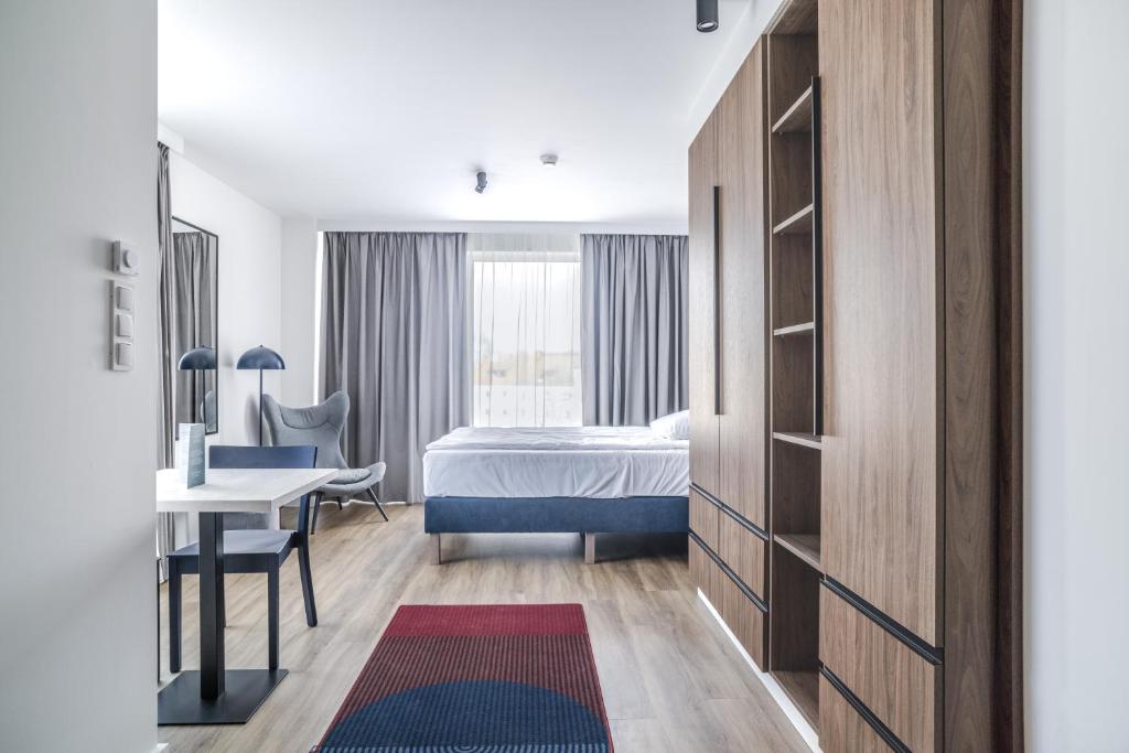 Postel nebo postele na pokoji v ubytování Noli Gdansk Wrzeszcz