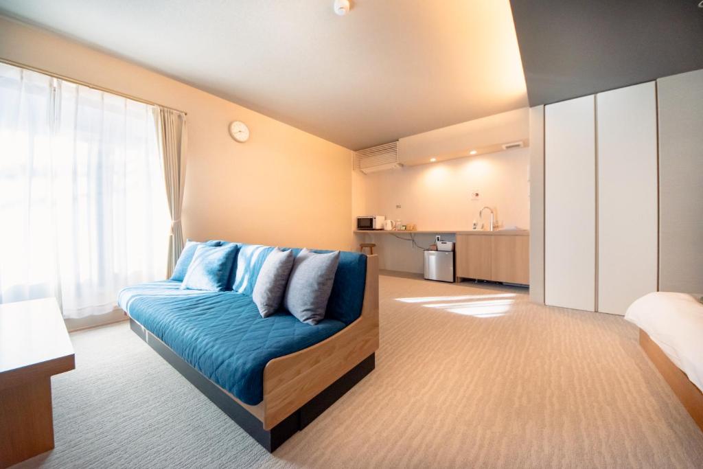 Postel nebo postele na pokoji v ubytování Hotel Rokune