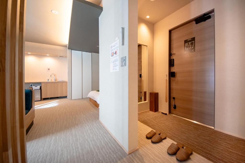Postel nebo postele na pokoji v ubytování Hotel Rokune