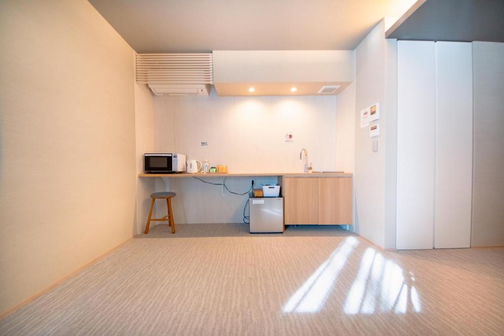 Kuchyň nebo kuchyňský kout v ubytování Hotel Rokune