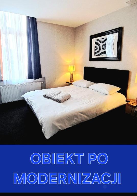 Postel nebo postele na pokoji v ubytování Villa Grudziądz
