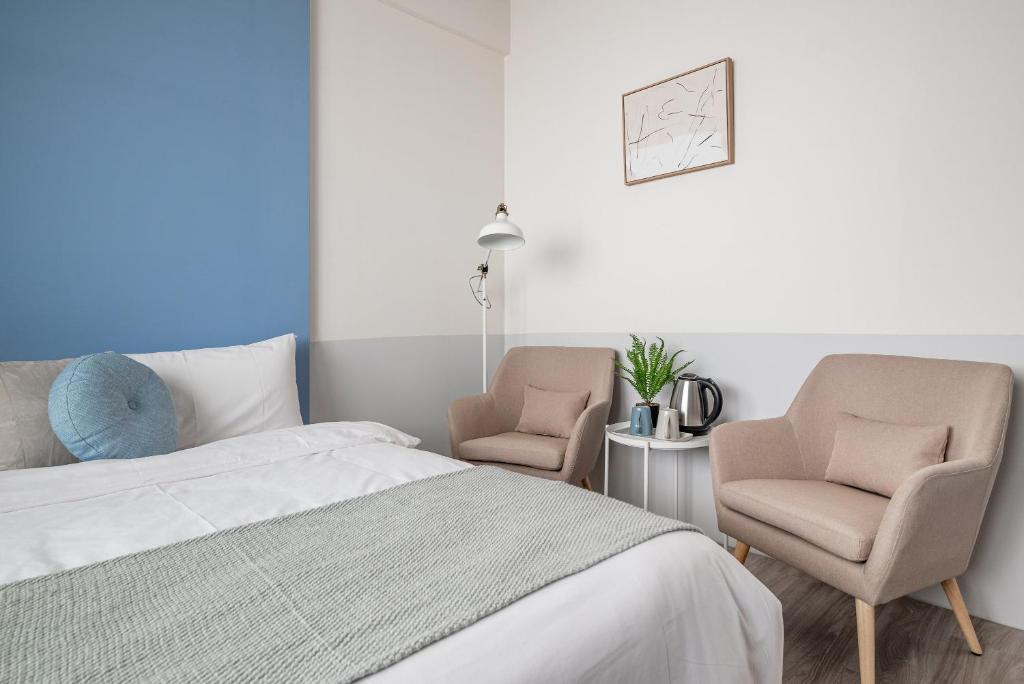 Postel nebo postele na pokoji v ubytování Penghu Yun Ting Style Inn