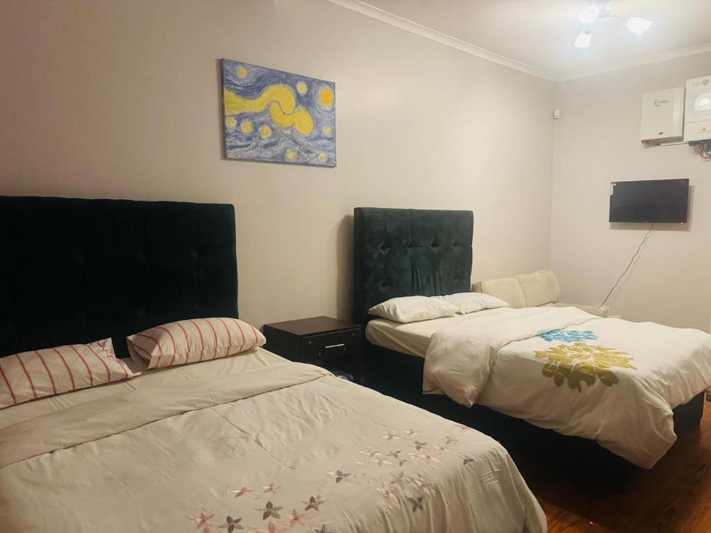 Ένα ή περισσότερα κρεβάτια σε δωμάτιο στο HomeAway Self Catering Accommodation