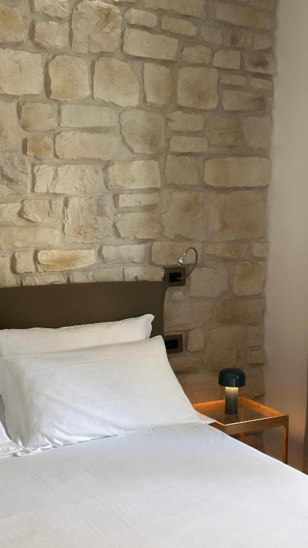 Postel nebo postele na pokoji v ubytování Olivia Rooms Teocrito