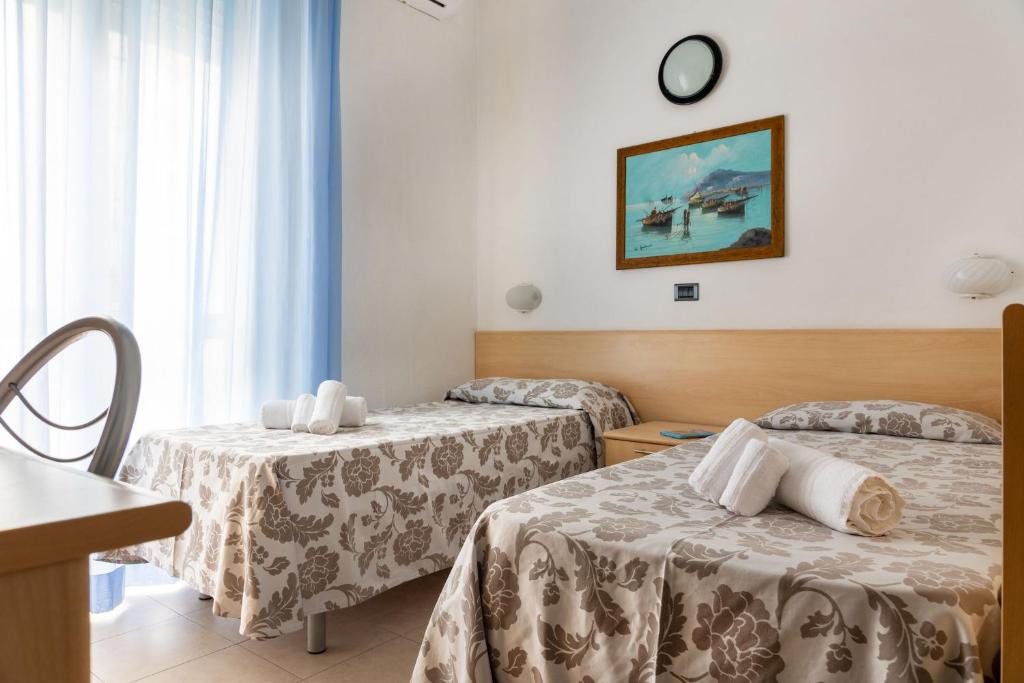 Postel nebo postele na pokoji v ubytování Nautilus Hotel Family