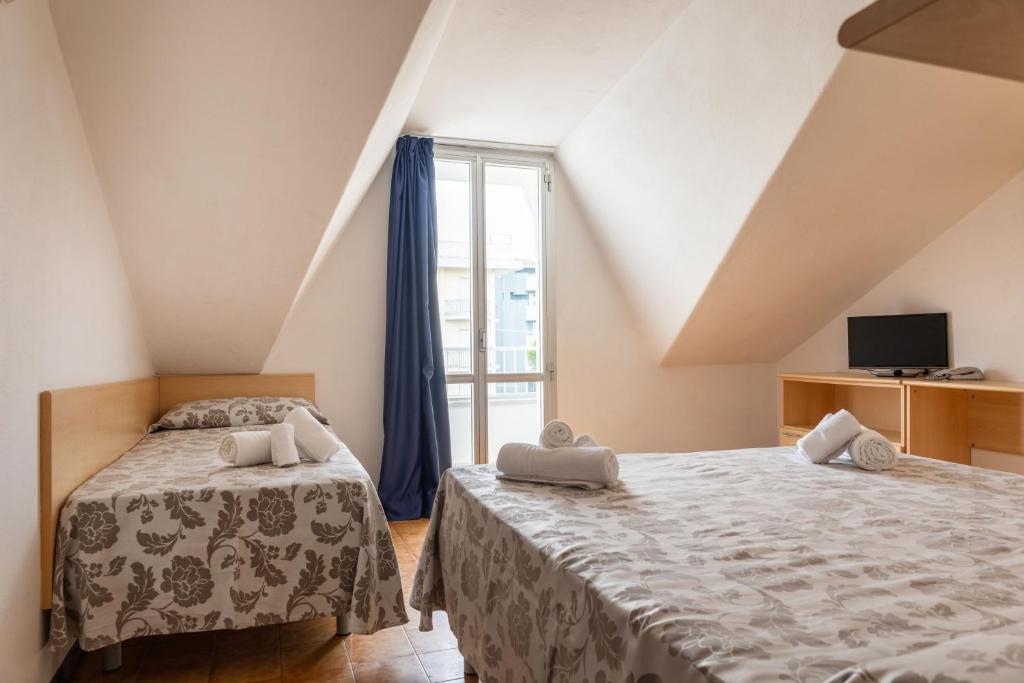 Postel nebo postele na pokoji v ubytování Nautilus Hotel Family