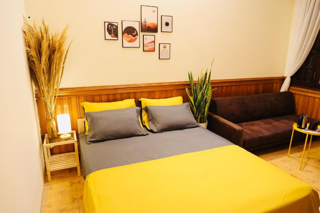 Postel nebo postele na pokoji v ubytování Homestay Lăng Bác