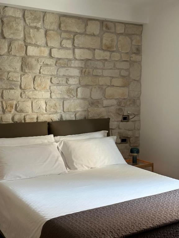 Postel nebo postele na pokoji v ubytování Olivia Rooms Teocrito