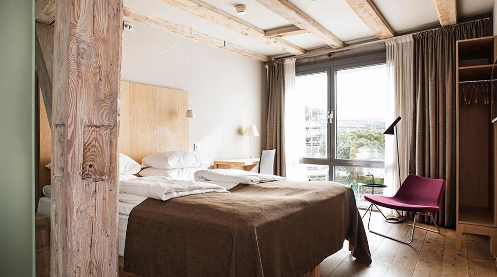 Postel nebo postele na pokoji v ubytování Hotel Brosundet