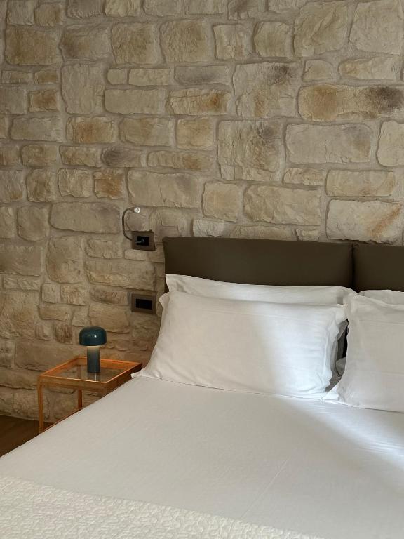 Postel nebo postele na pokoji v ubytování Olivia Rooms Teocrito