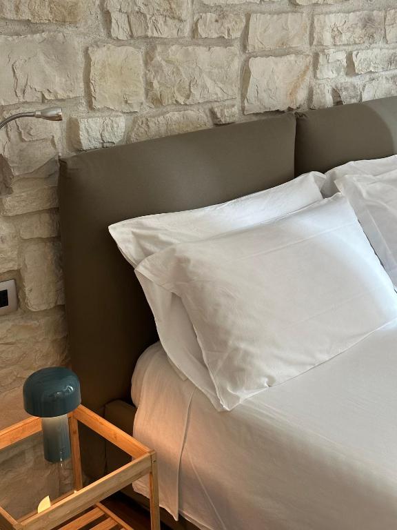 Postel nebo postele na pokoji v ubytování Olivia Rooms Teocrito