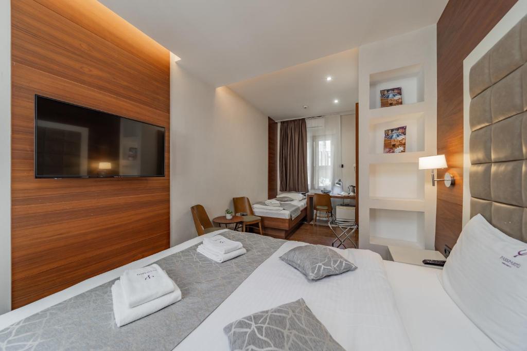 Postel nebo postele na pokoji v ubytování Passpartu Garni hotel Rooms