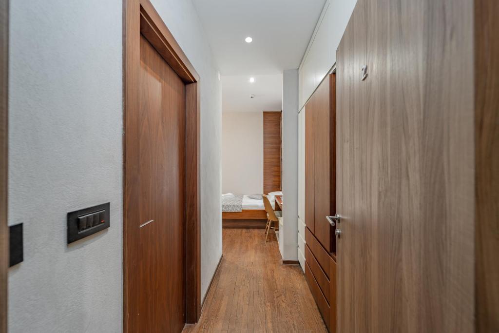 Postel nebo postele na pokoji v ubytování Passpartu Garni hotel Rooms