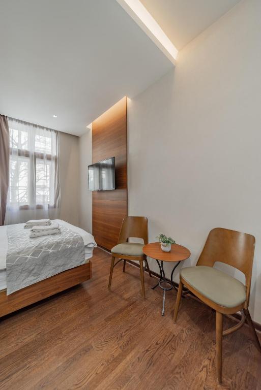 Postel nebo postele na pokoji v ubytování Passpartu Garni hotel Rooms