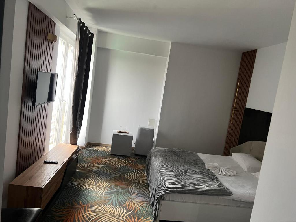 Postel nebo postele na pokoji v ubytování Hotel Sydney