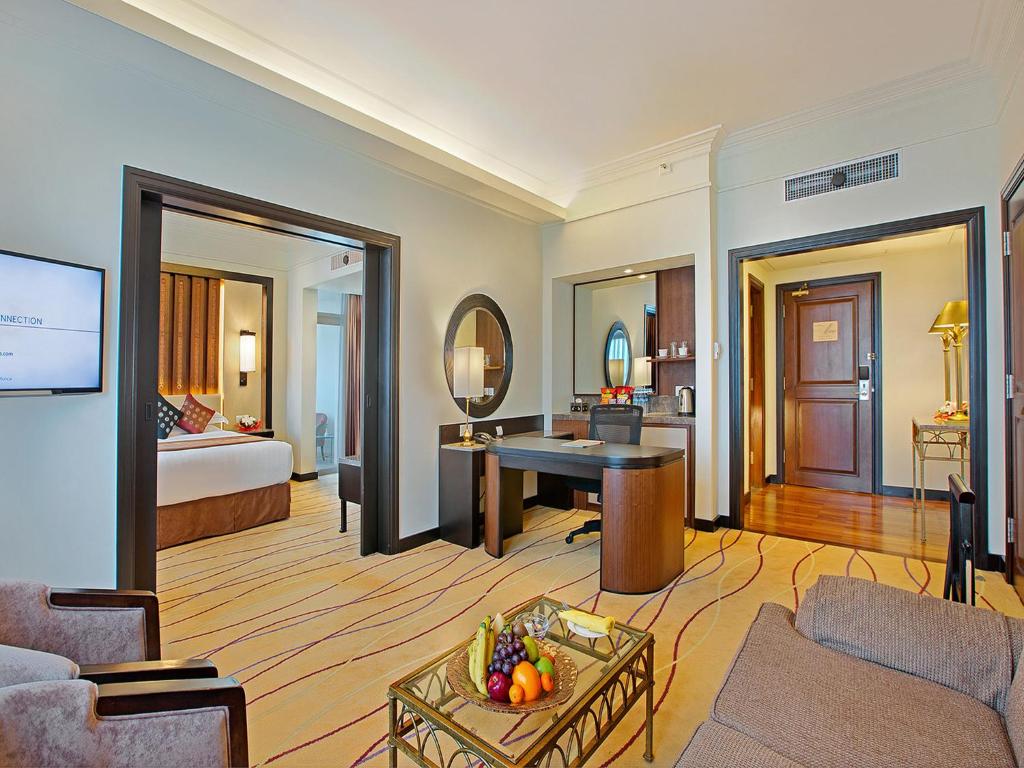 A bed or beds in a room at PARKROYAL Yangon