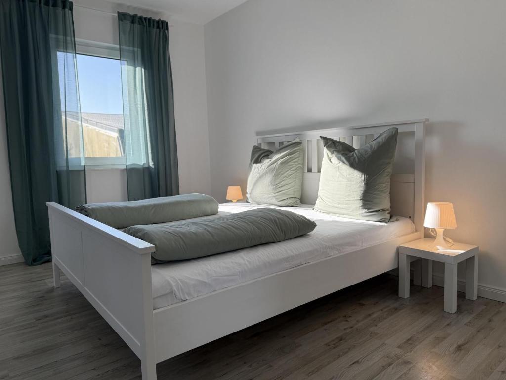 Postel nebo postele na pokoji v ubytování Heide-Liebe Appartment