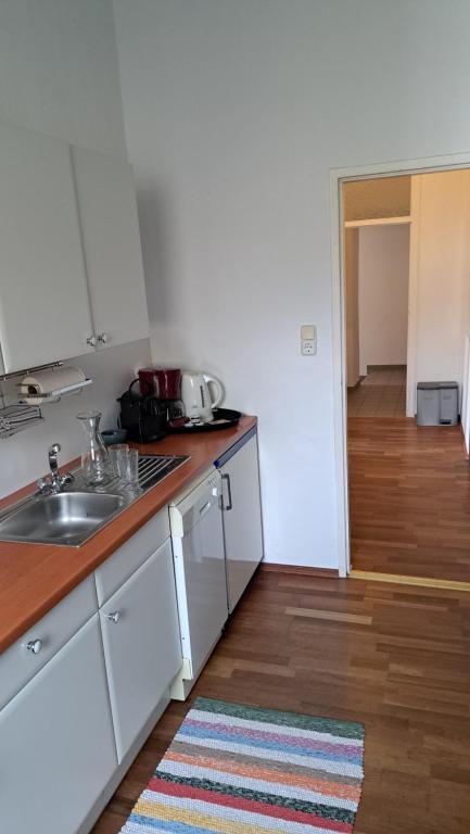 a kitchen with a sink and a counter top at Am Baalstein in Traunkirchen