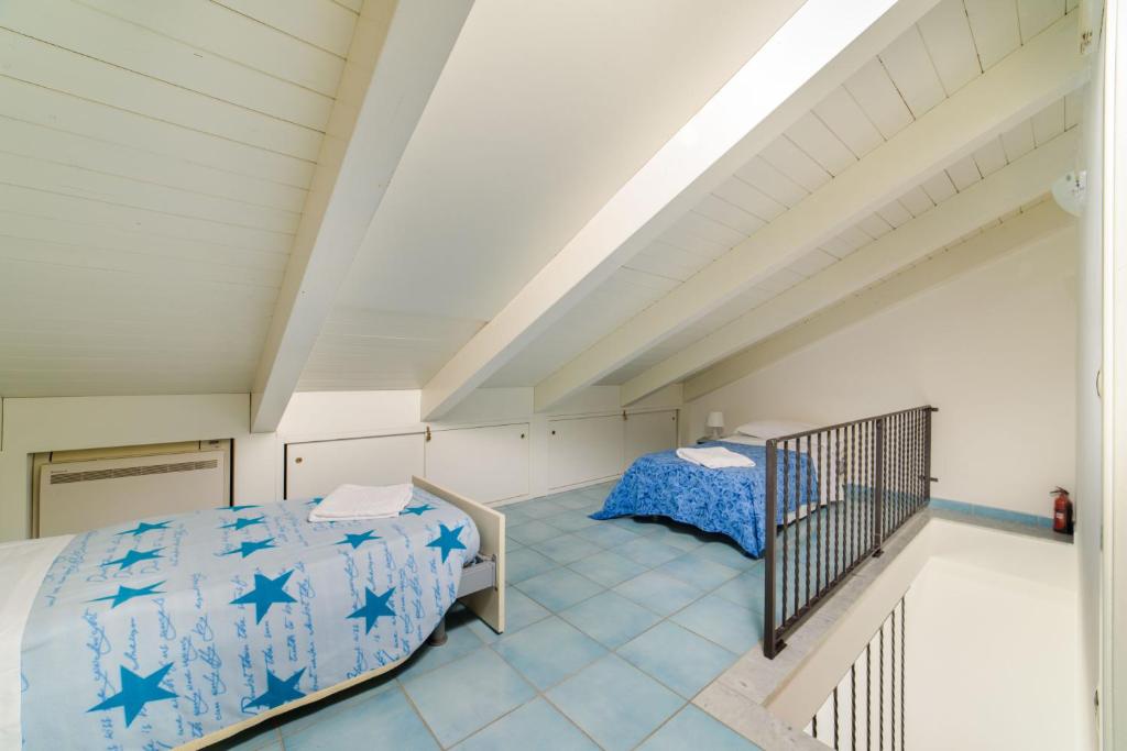 A bed or beds in a room at LUIMAR Holiday House