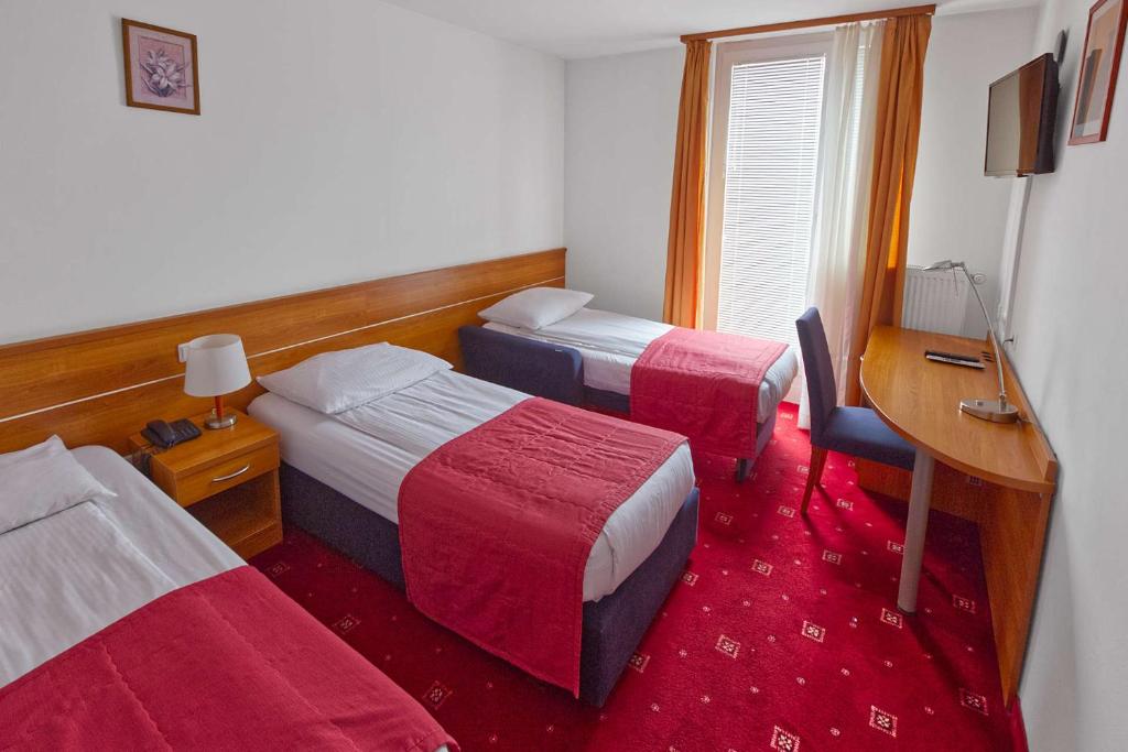Postel nebo postele na pokoji v ubytování Hotel Creina