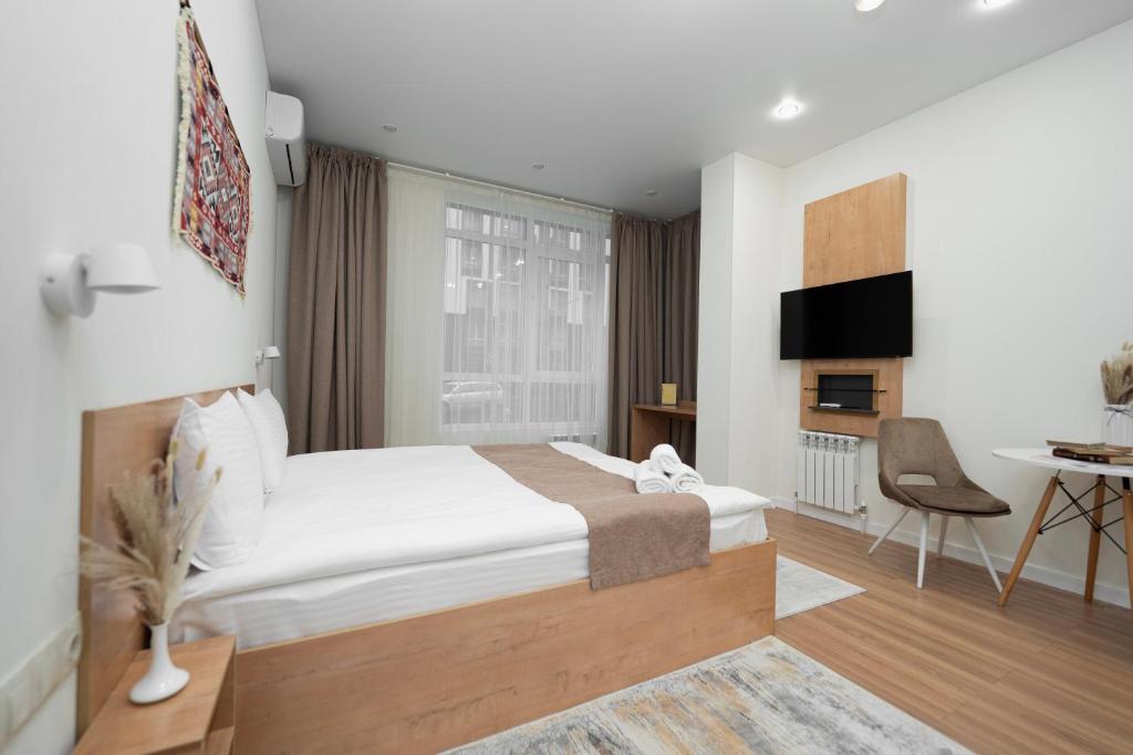 Ένα ή περισσότερα κρεβάτια σε δωμάτιο στο Q Apartment