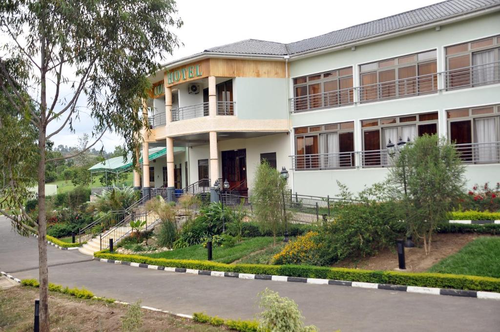 a building with a street in front of it at Igongo Country Hotel & Cultural Centre in Kyabinunga