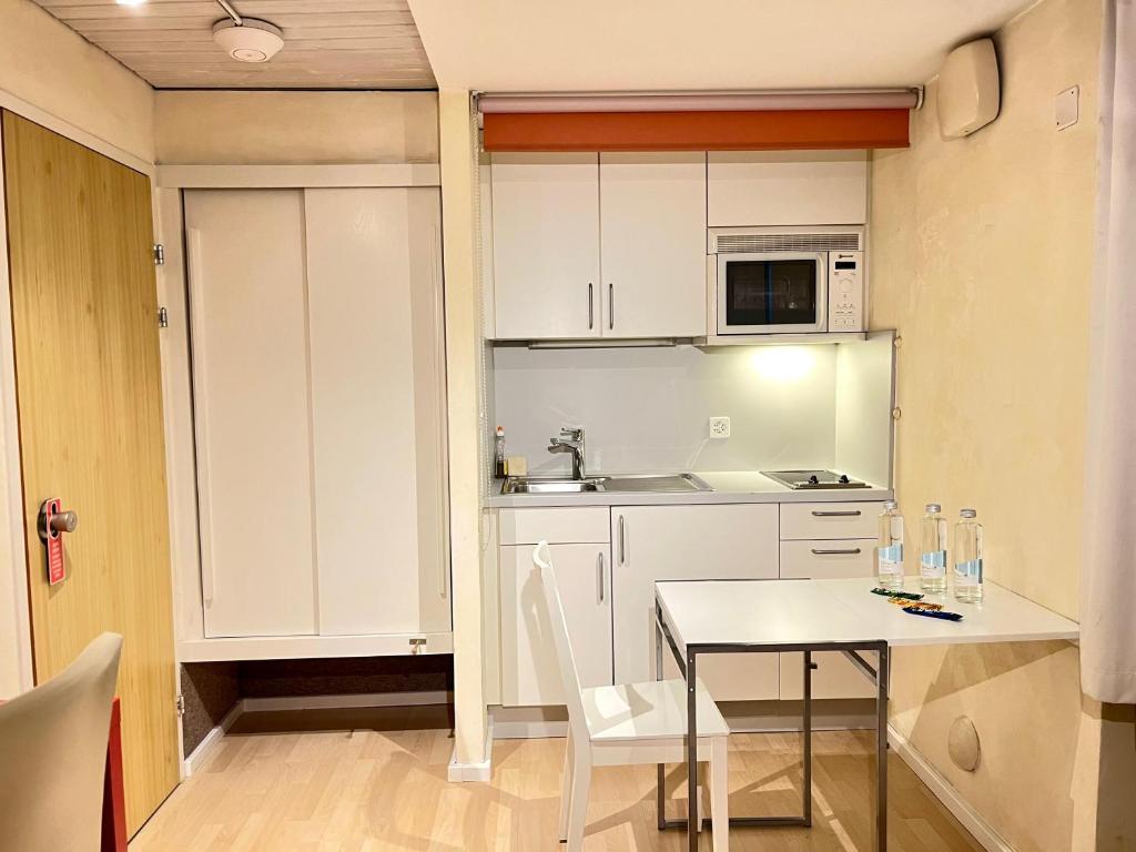 Kuchyň nebo kuchyňský kout v ubytování Seiler's Hotel