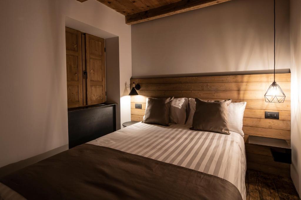 Postel nebo postele na pokoji v ubytování Casa Pasini-Foresteria