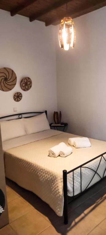 Postel nebo postele na pokoji v ubytování Seaside Residence Kiki Prassa,Kimolos