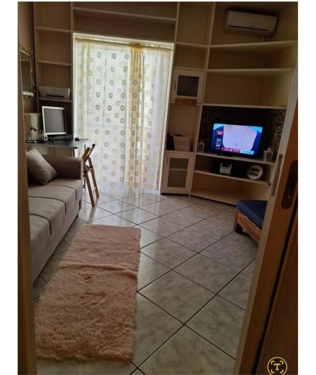 TV a/nebo společenská místnost v ubytování Άρτεμις