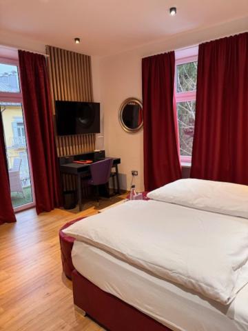 Postel nebo postele na pokoji v ubytování Hotel Almrausch