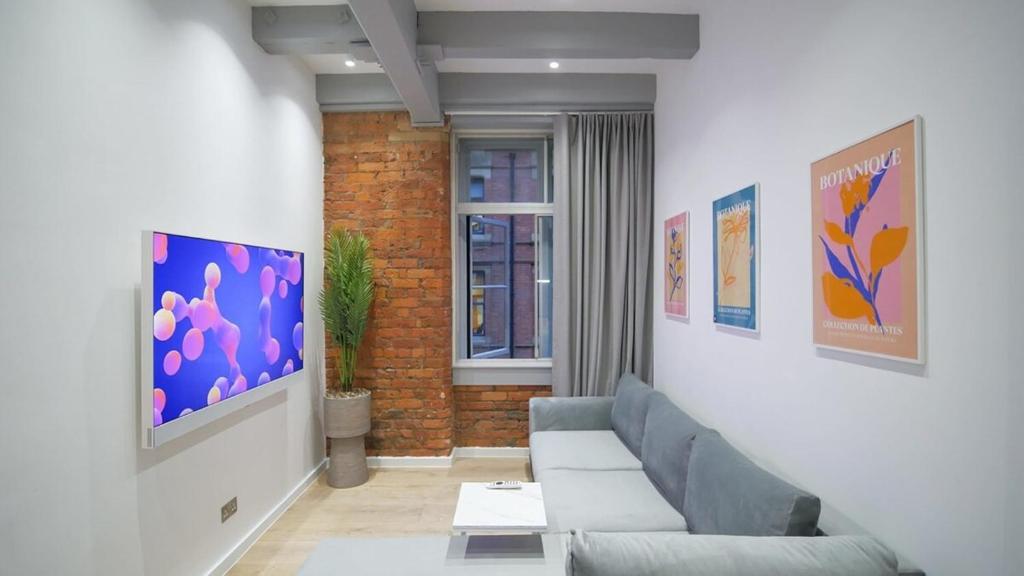 TV a/nebo společenská místnost v ubytování Chicago by The Heim Residences