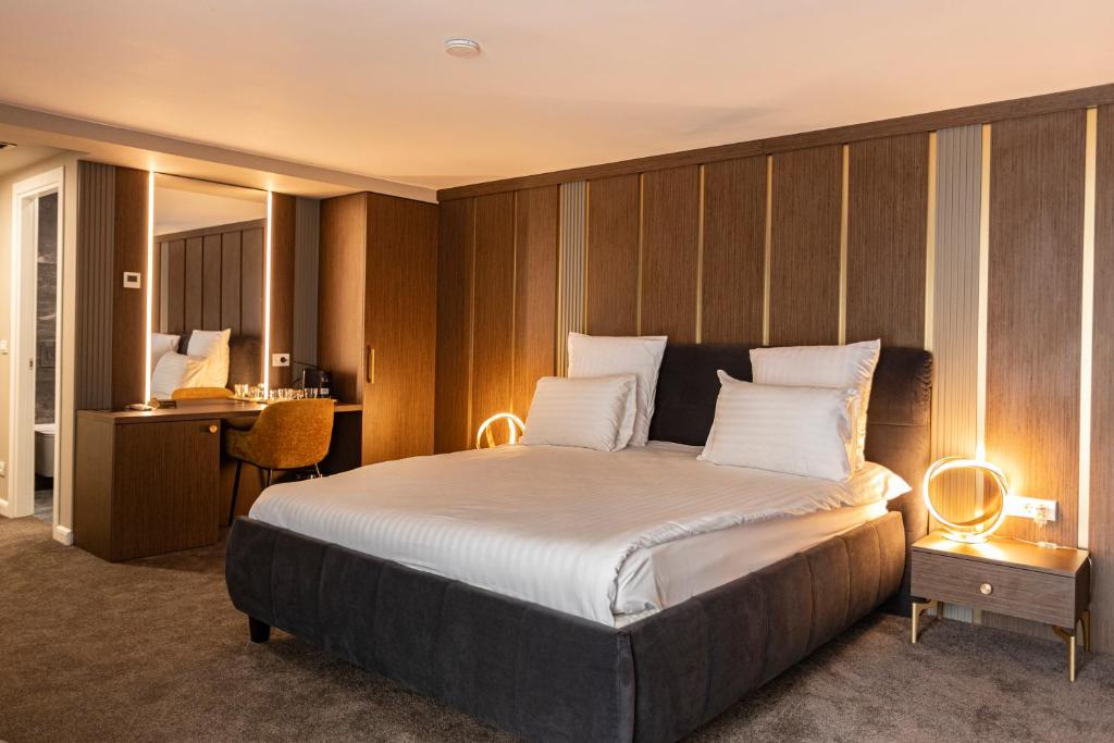 Postel nebo postele na pokoji v ubytování Ganzo Boutique Hotel