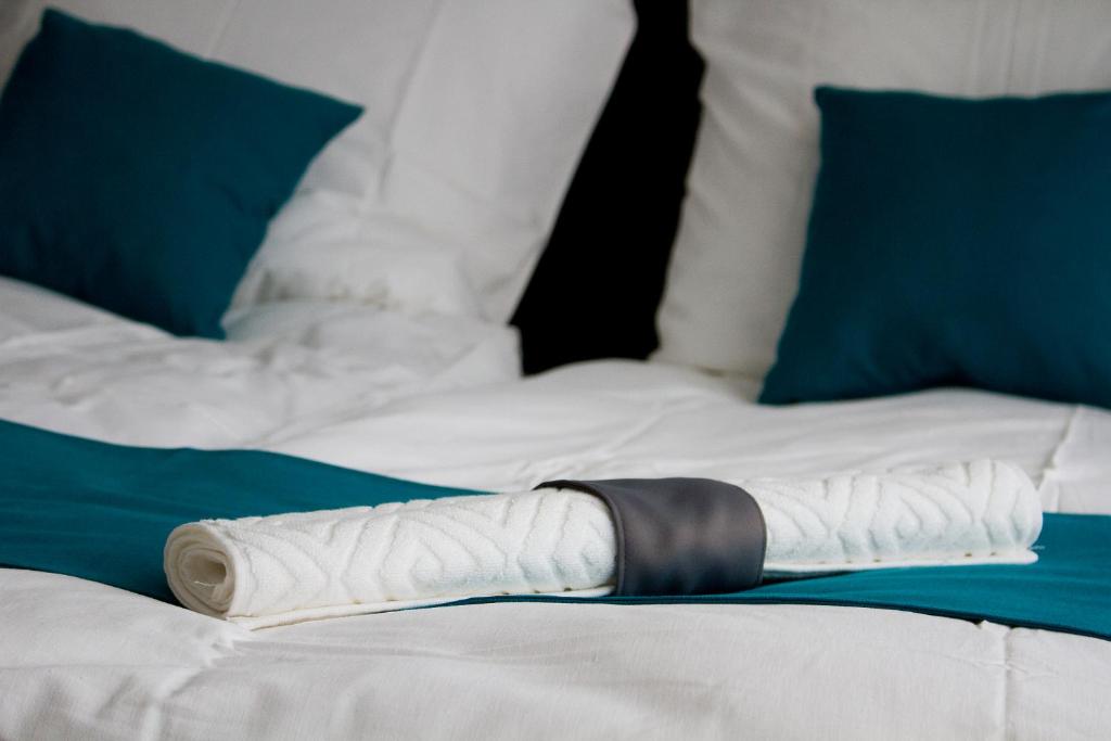 a bed with a wrapped up limb on it at Spirit House Eger in Eger