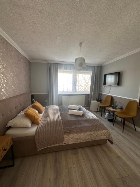 Łóżko lub łóżka w pokoju w obiekcie Jager Guesthouse