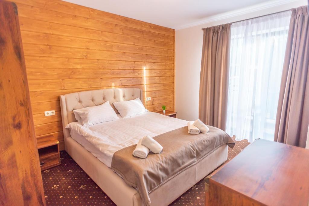 Postel nebo postele na pokoji v ubytování Residence Chalet & Nesh