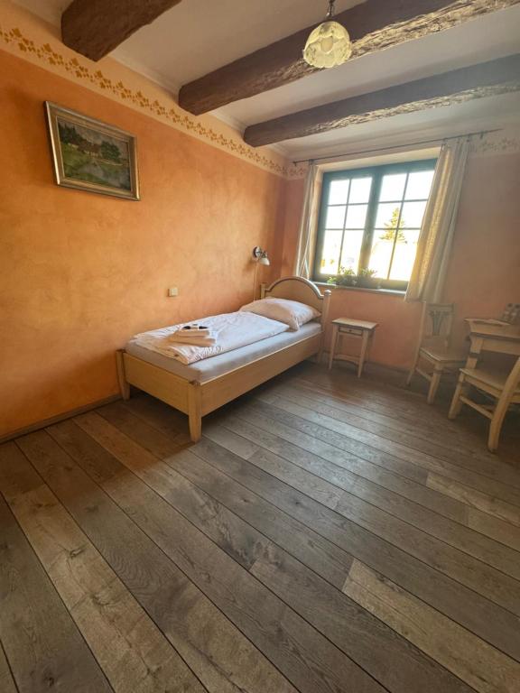 Postel nebo postele na pokoji v ubytování Axiom penzion Prostějov