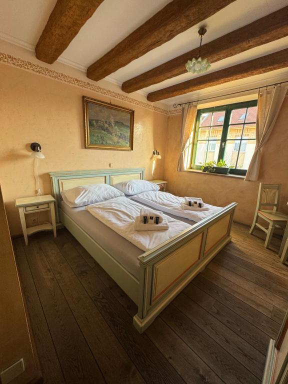 Postel nebo postele na pokoji v ubytování Axiom penzion Prostějov