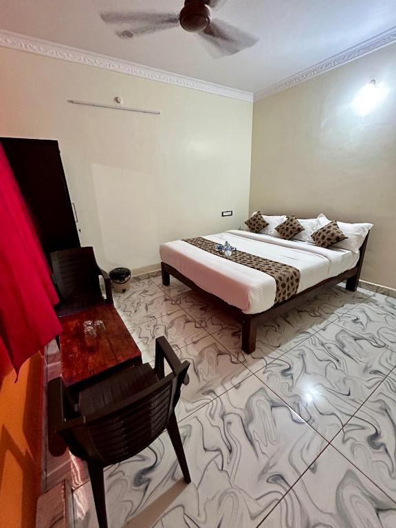 Rúm í herbergi á Le Oasis Auro'Ra