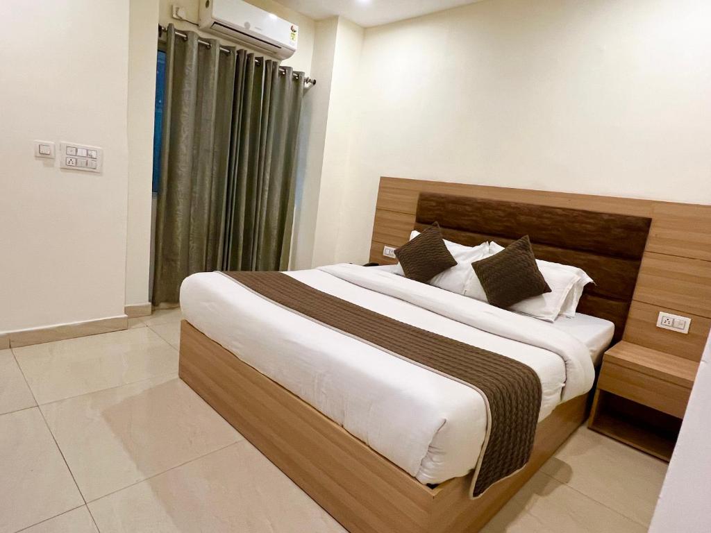 Postel nebo postele na pokoji v ubytování The Reo Lodge, Haridwar
